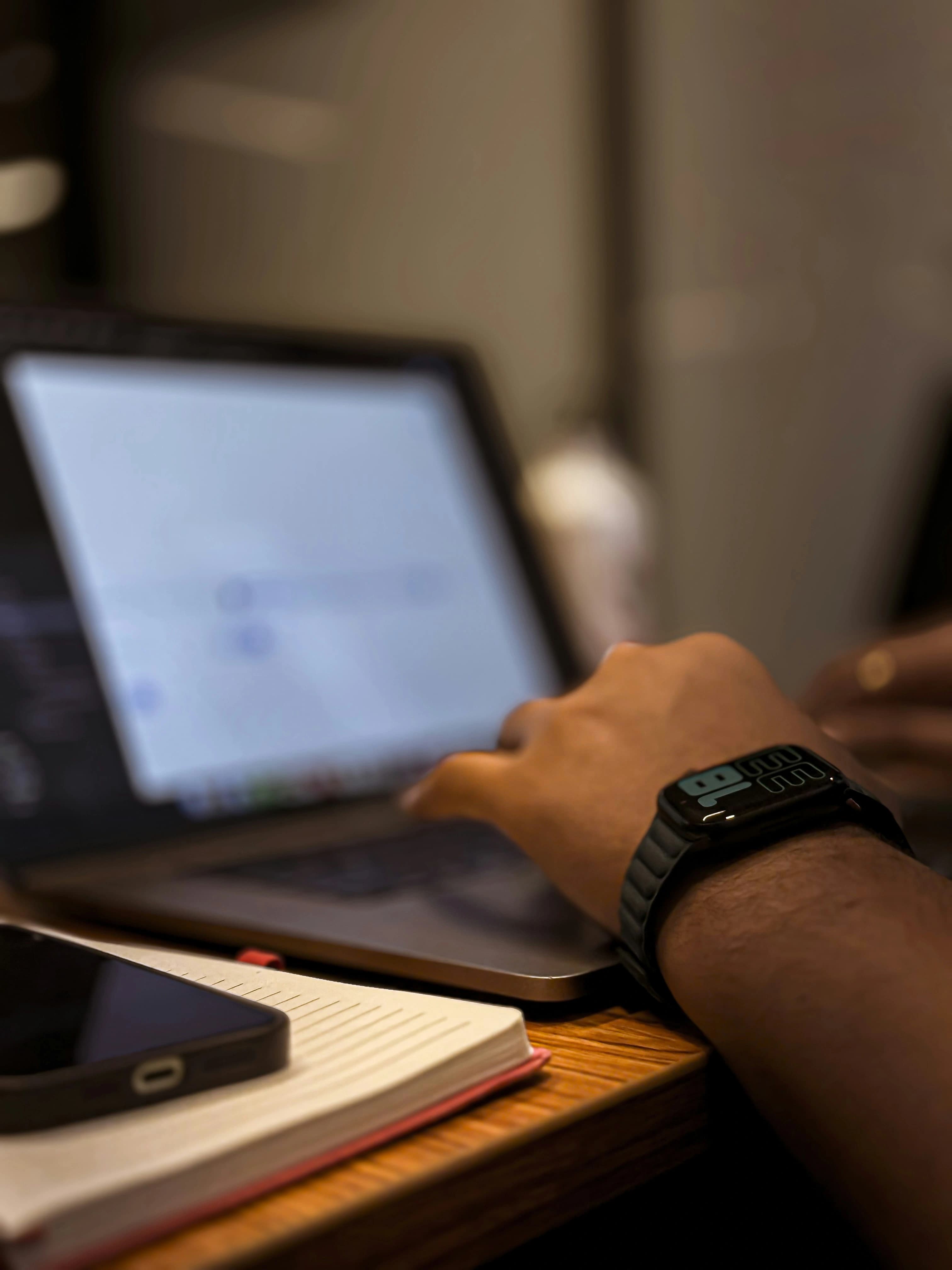 Hands at a laptop building a website and app - Matjila and Phiri Projects